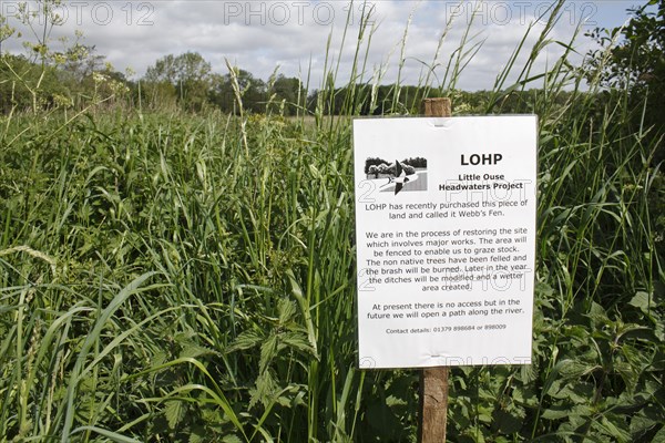 Information sign at recently purchased land for fen habitat restoration project