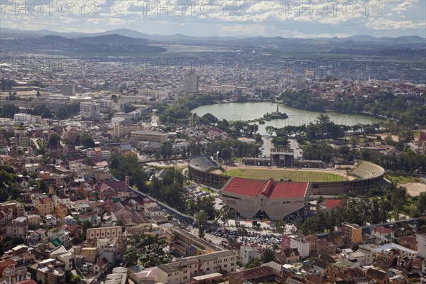 View of city with sports stadium and lake