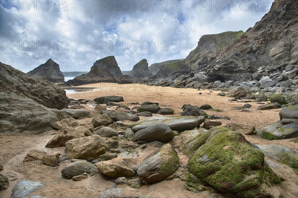 View of beach with slate outcrops