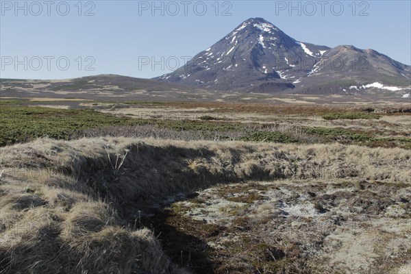 Foundations of Ainu dwelling and tundra on volcanic island