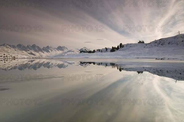 Kalkkoegel mountain range reflected in a small lake