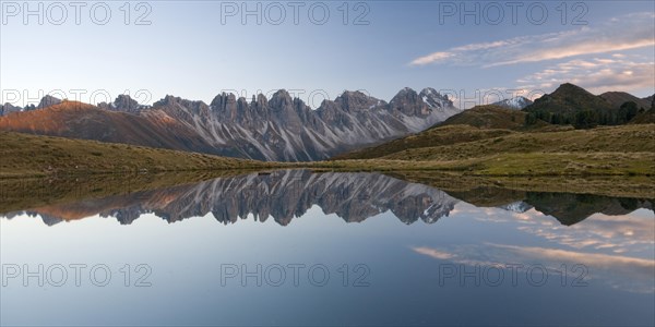 Kalkkoegel mountain range reflected in a small lake