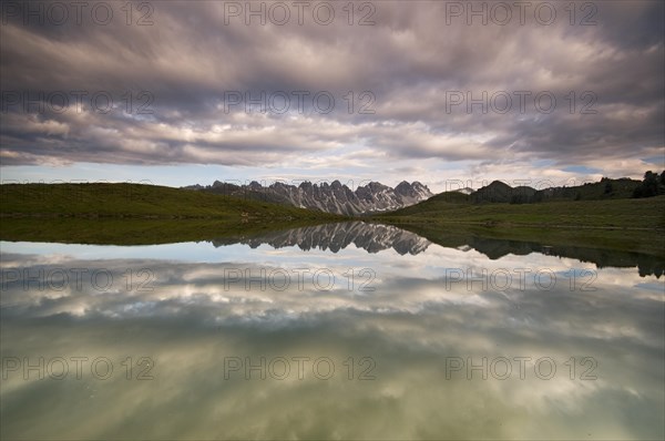 Kalkkoegel mountain range reflected in a small lake