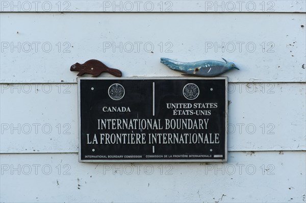 Sign at the border between Canada and the United States of America