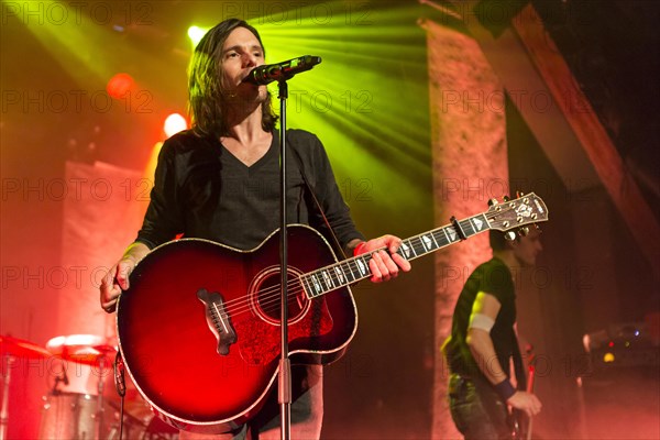 Lead singer and frontman Adrian Sieber from the Swiss pop band Lovebugs performing live in the Schueuer concert hall