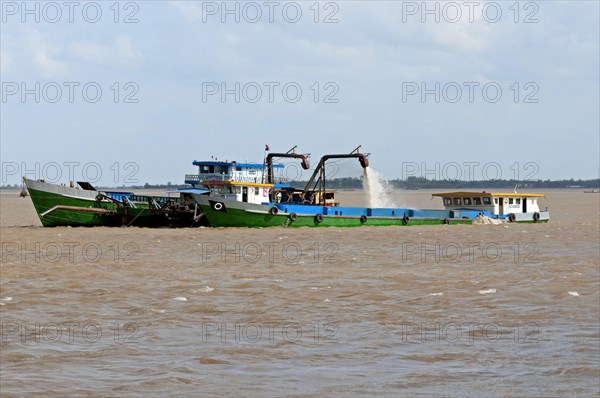 Suction dredger operating on the Mekong River