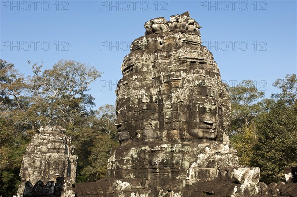 Tower with a face carved in stone