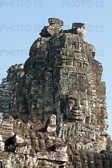 One of the more than 50 mystical towers of Bayon Temple with huge carved stone faces