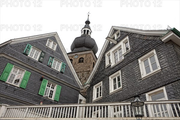 Protestant parish church with houses with slate fronts in the historic town centre of Lennep