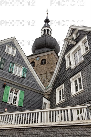 Protestant parish church with houses with slate fronts in the historic town centre of Lennep