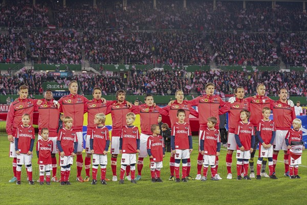 The Austrian team poses before the WC qualifier soccer game on October 16