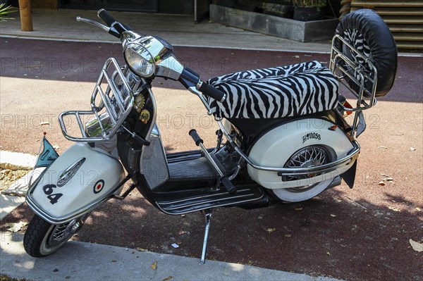 Vespa scooter with a zebra design