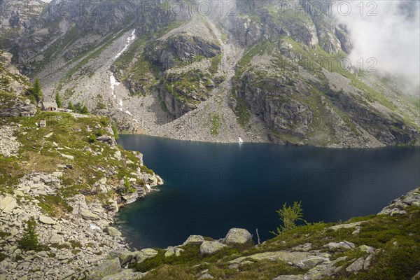 Alpine hut at the Lago della Crosa mountain lake