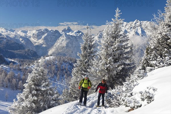 Man and a woman snowshoeing in Berchtesgaden National Park