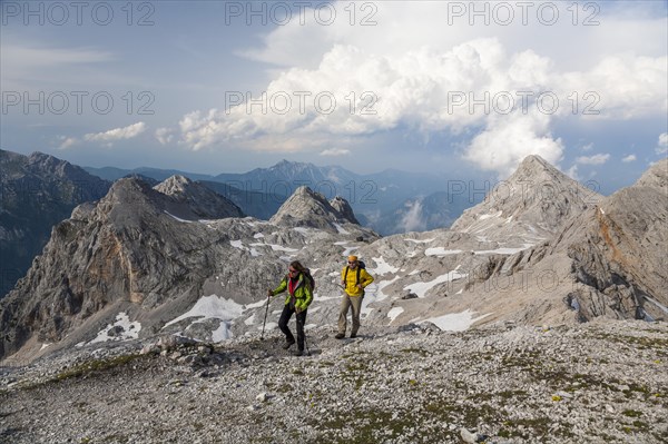 Man and a woman hiking on Kredarica Mountain