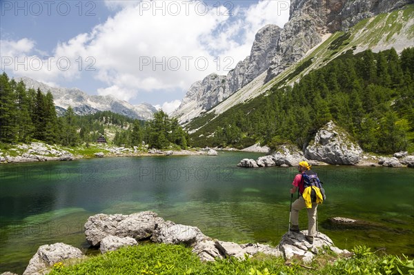 Hiker looking towards Koca pri Triglavskih jezerih