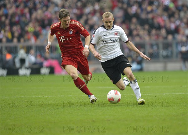 Duel between Bastian SCHWEINSTEIGER