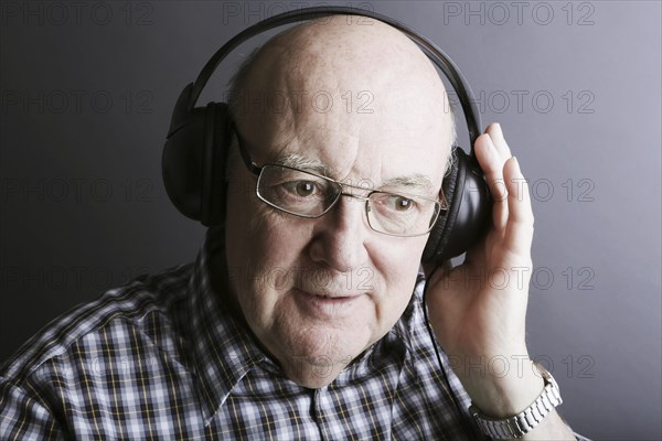 Senior wearing headphones