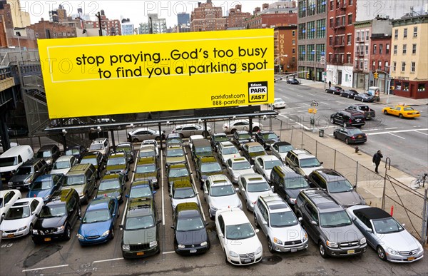 A private parking lot with a billboard in Chelsea