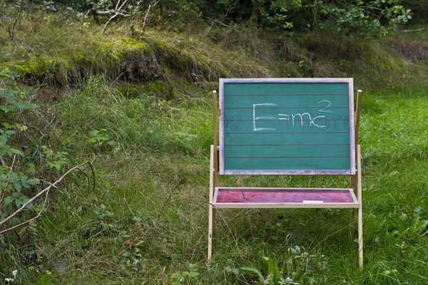 Children's blackboard with Einstein's formula E = mcÂ²