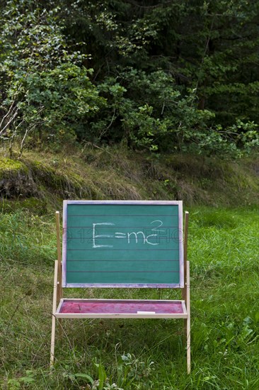 Children's blackboard with Einstein's formula E = mcÂ²