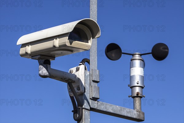 Surveillance camera and an anemometer to measure the wind speed