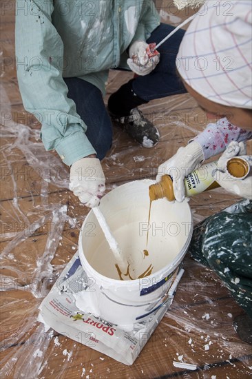 Mother and daughter renovating a room