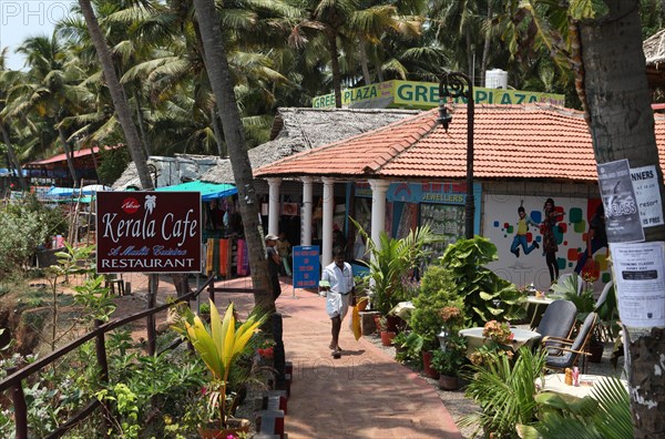 Restaurants and shops under palm trees