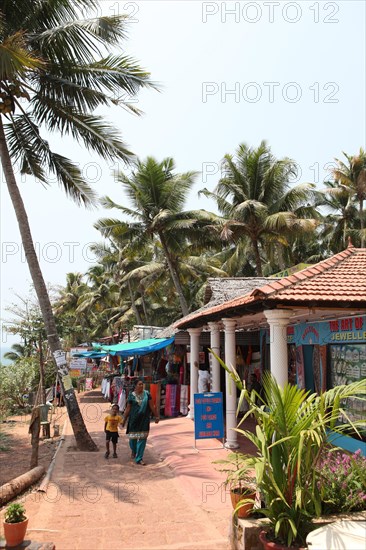 Restaurants and shops under palm trees