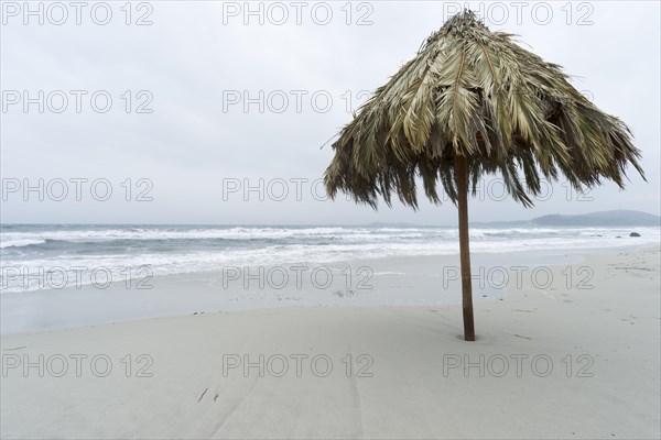 Parsol in bad weather on the Simius beach