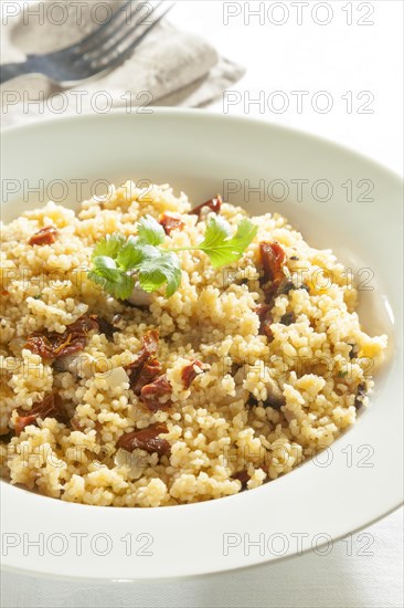 Cous cous with sundried tomatoes and mushrooms