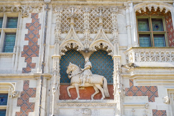 Statue of Louis XII on the front facade of Château Royal de Blois castle