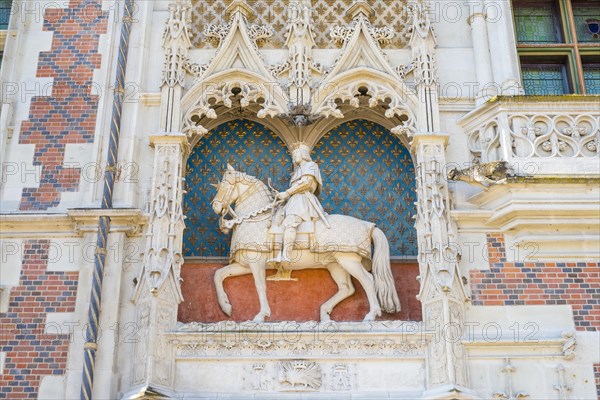 Statue of Louis XII on the front facade of Chateau Royal de Blois castle