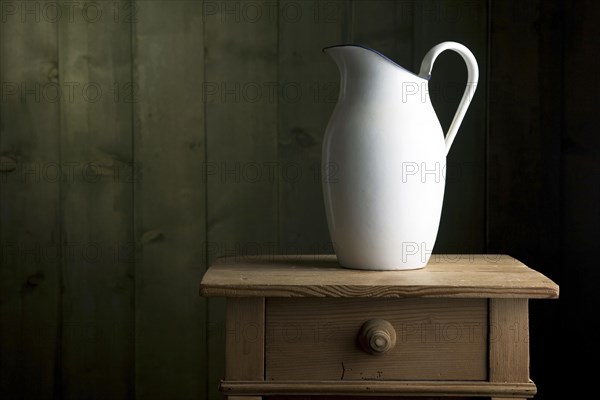 Old enamel jug on a small chest of drawers