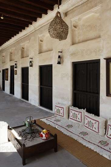 Veranda with a seating area on the ground