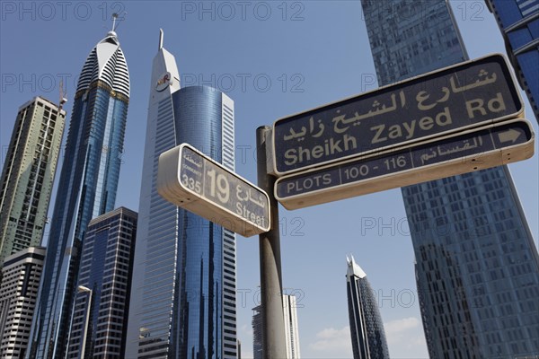 Street sign for Sheikh Zayed Road in front of skyscrapers
