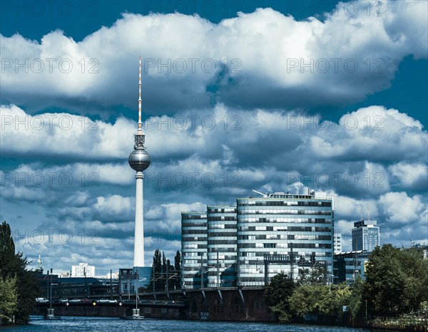 View of the television tower and the office buildings of the Berliner Verkehrsbetriebe transport company on Holzmarktstrasse as seen from the banks of the Spree river