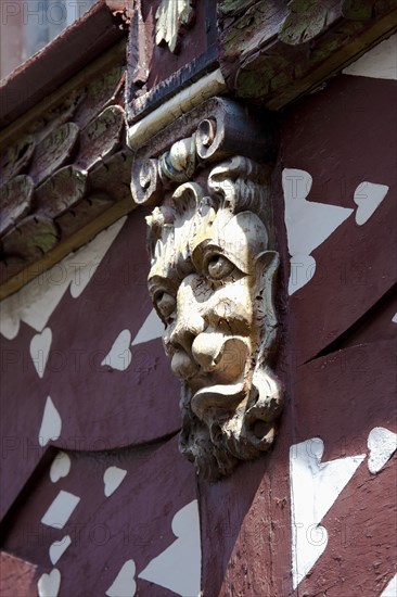 Historic half-timbered building with wall decorations at Burggraben