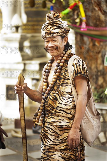 Animist hermit says healing prayers and tells fortunes at Doi Suthp Buddhist temple in Chiang Mai