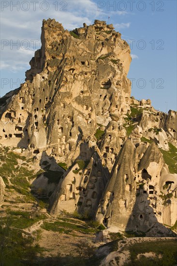 Fortress of Uchisar surrounded by Fairy Chimneys made of tufa