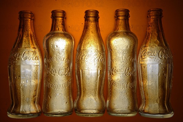 Various historic Coca-Cola bottles