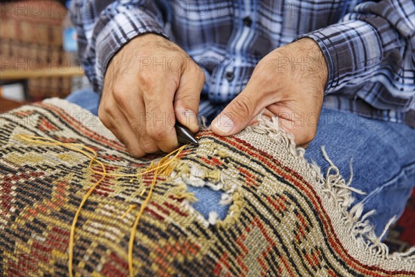 Man patching a carpet