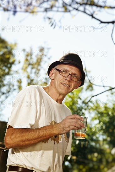 Man with freshly squeezed apple juice