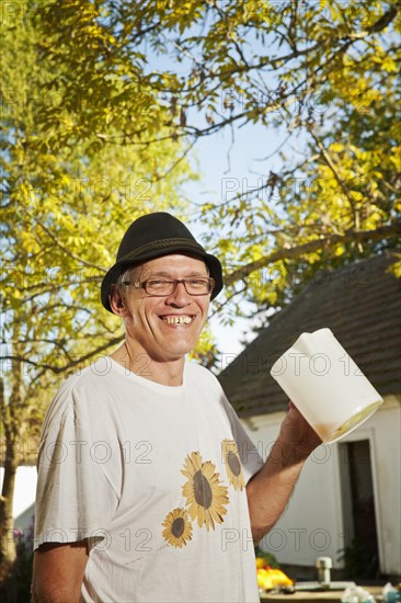 Man with freshly squeezed apple juice