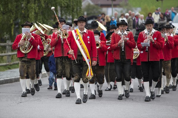 The Weissensee marching band in traditional costumes performing at the Naturparkfest festival in Techendorf