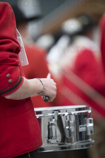 Drummer of the Weissensee marching band in traditional costume performing at the Naturparkfest festival in Techendorf