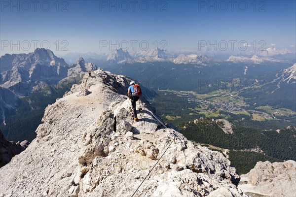 Climber walking on the Marino Bianchi fixed rope route