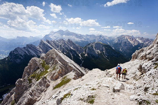 Hikers on their way down from the summit of Cristallino mountain
