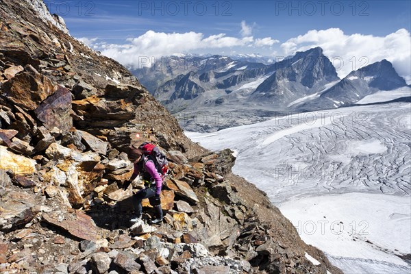 Mountain climber ascending Schneebiger Nock Mountain
