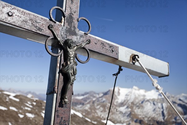 Summit cross on the summit of Wilden Kreuzspitze Mountain in the Pfunderer Mountains